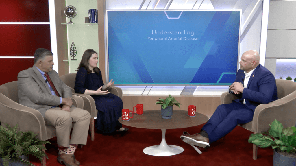 Dr. Peña and Dr. McMackin sitting in a conference room with host Jeremy Andrews discussing managing PAD access complications.