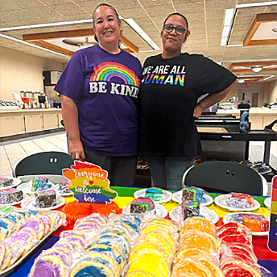 Cook employees hand out cookies for a Pride Month celebration at our Bloomington headquarters
