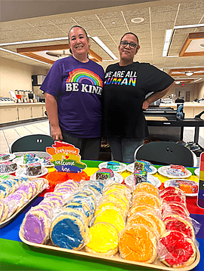 Employees with Pride Month cookies
